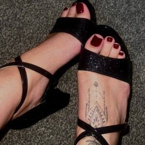 Worn black glitter heels